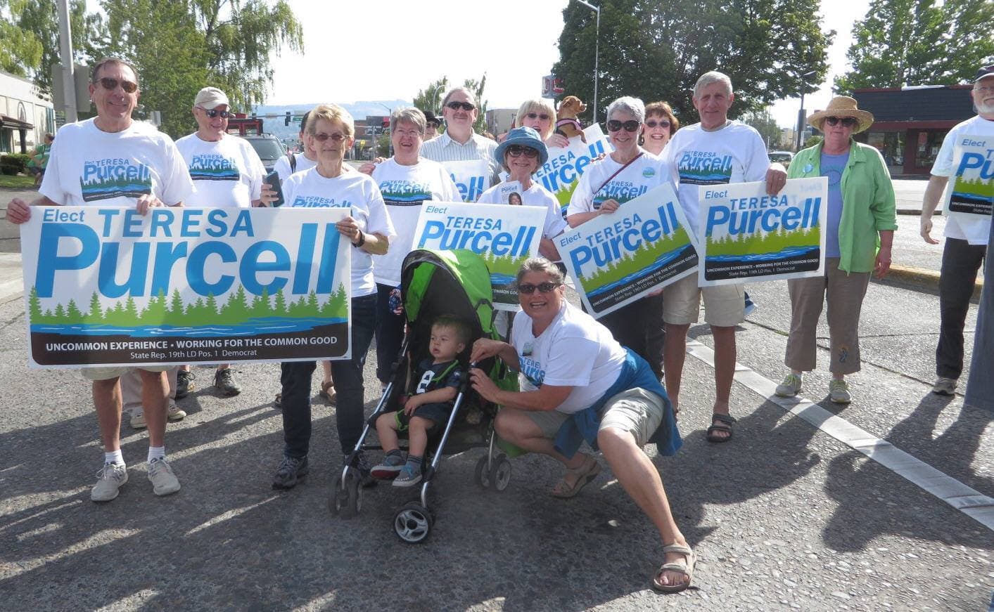 Teresa with campaign supporters holding Purcell signs
